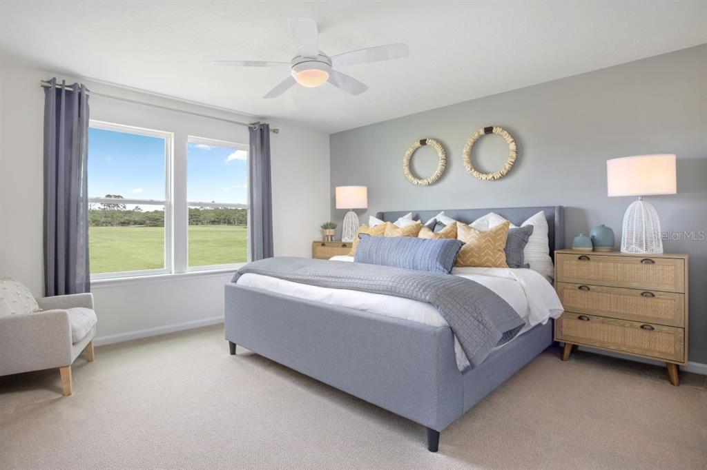 4 Gilded Court Flagler Beach, FL 32136 - Photo 10 of 12 a bedroom with a bed and a window