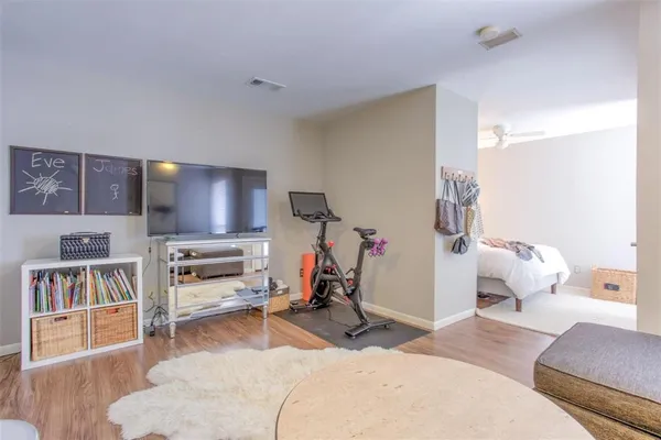 a room with furniture and a flat screen tv