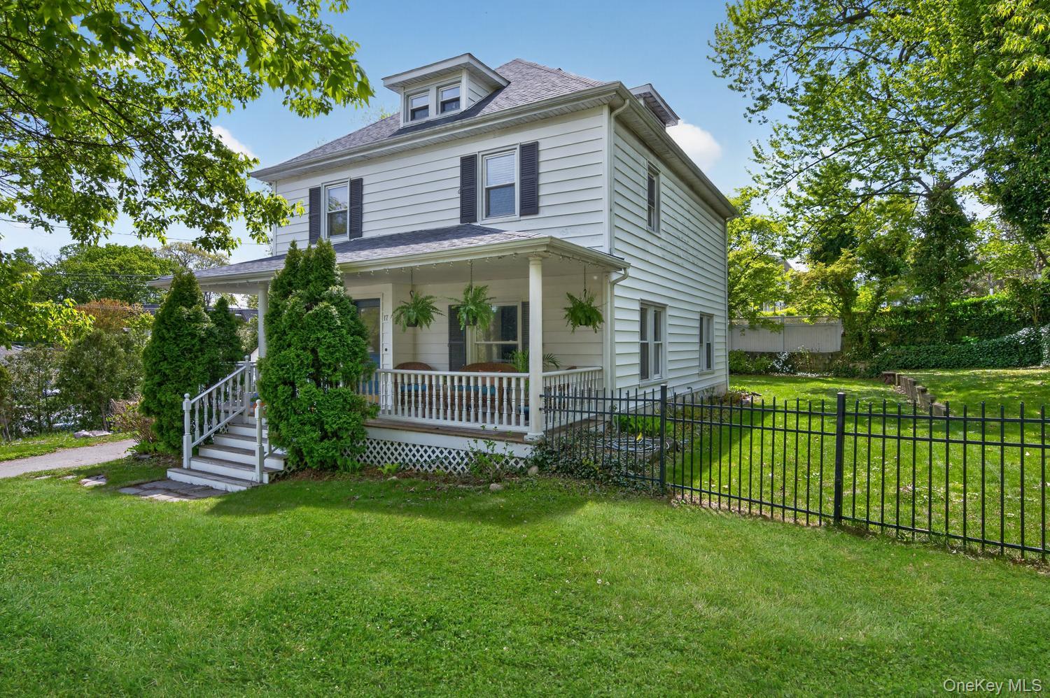 17 Riggs Place Locust Valley, NY 11560 - Photo 3 of 25 Front view with glimpse into fenced in back yard
