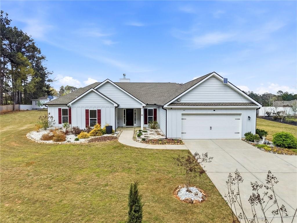 a view of a house with swimming pool and sitting area