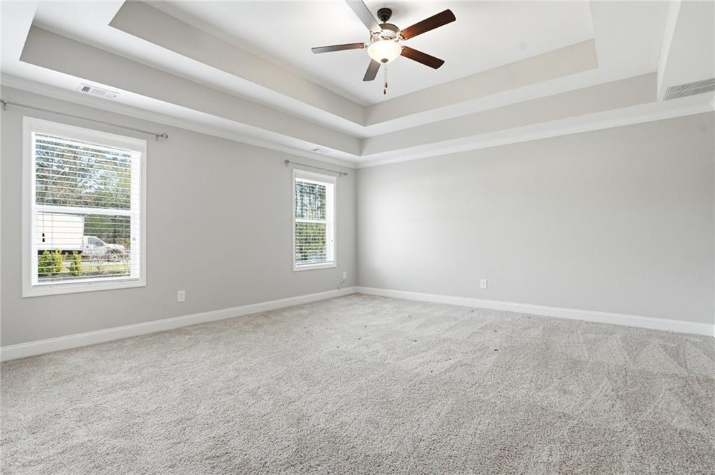 649 Tanners Bridge Road Bethlehem, GA 30620 - Photo 13 of 30 an empty room with windows and fan