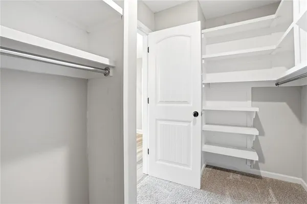 a view of an empty walk in closet