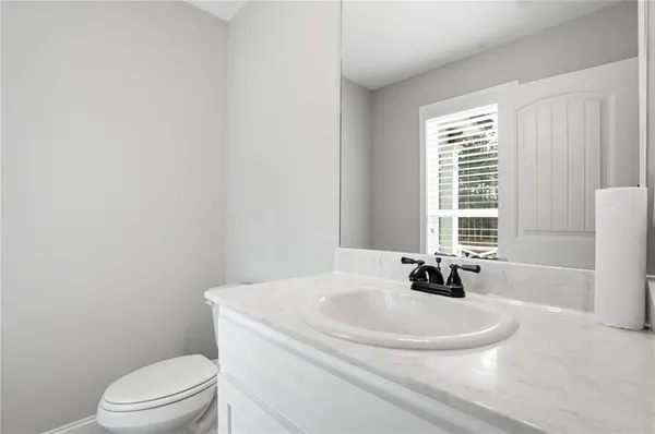 a bathroom with a sink a toilet and tub