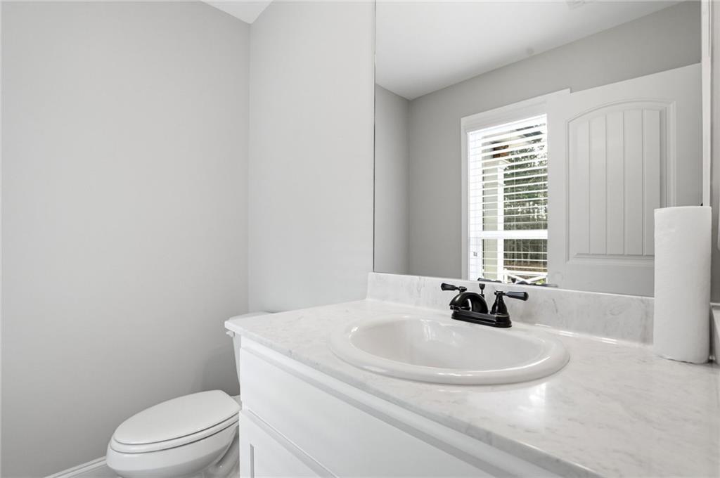 649 Tanners Bridge Road Bethlehem, GA 30620 - Photo 18 of 30 a bathroom with a sink a toilet and tub