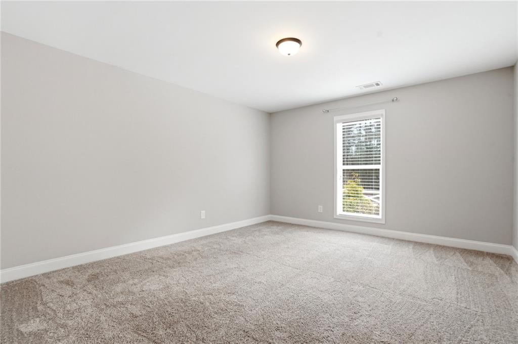 649 Tanners Bridge Road Bethlehem, GA 30620 - Photo 19 of 30 an empty room with windows