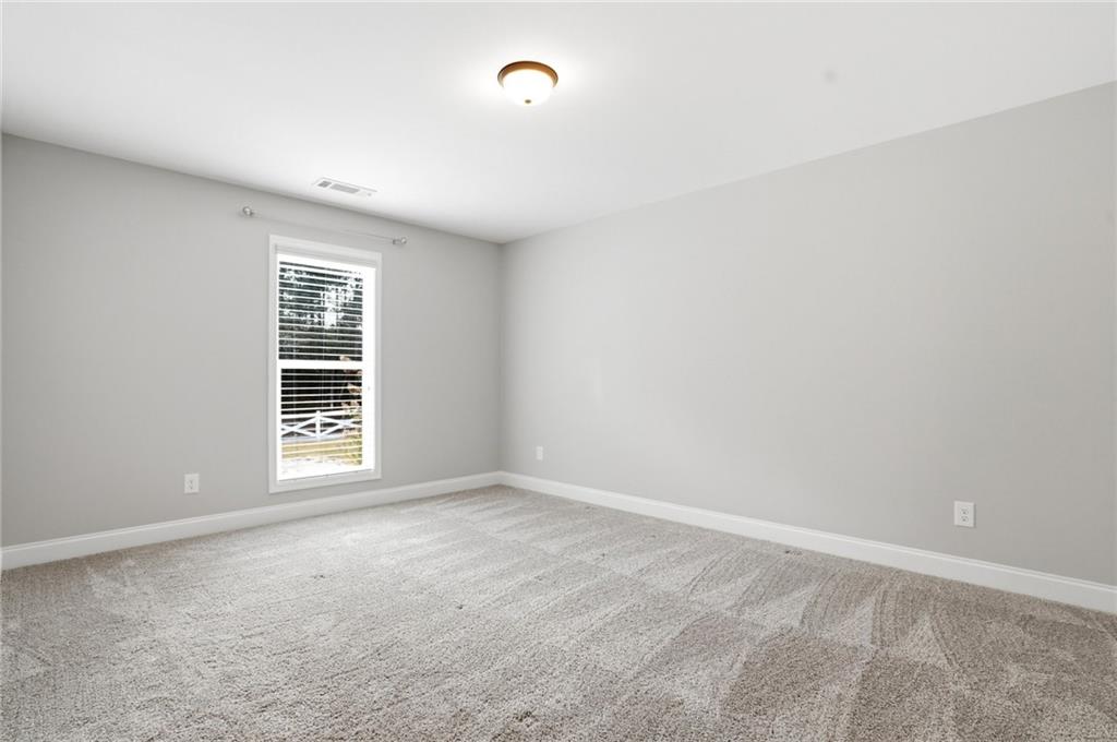649 Tanners Bridge Road Bethlehem, GA 30620 - Photo 20 of 30 a view of an empty room with a window