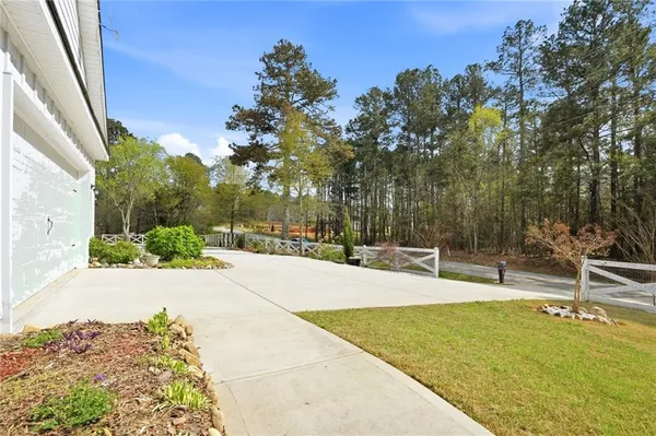 a swimming pool with outdoor seating and yard