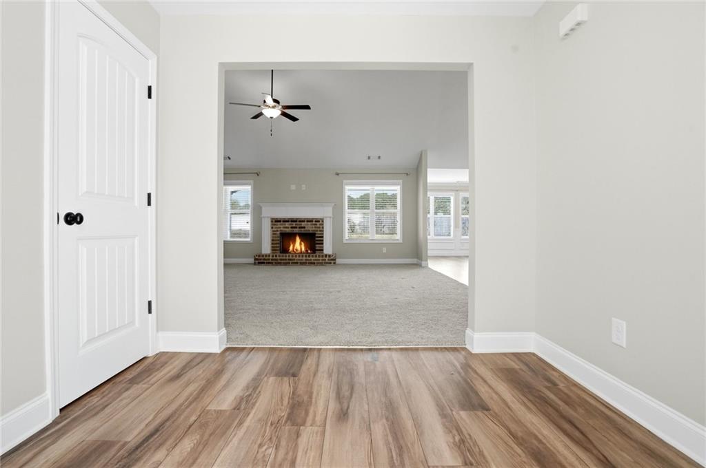 649 Tanners Bridge Road Bethlehem, GA 30620 - Photo 5 of 30 a view of empty room with wooden floor and window