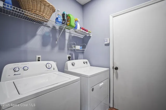 a en suite bathroom with a sink double vanity and a mirror