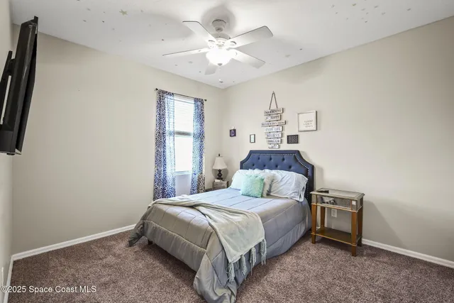 a view of yard with swimming pool and green space