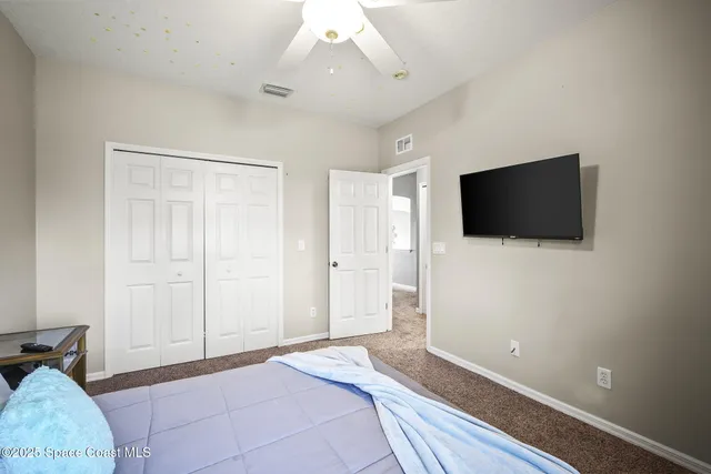 a view of a house with pool and chairs