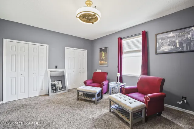 an aerial view of a house with a swimming pool