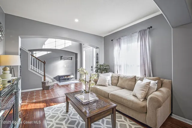 a view of a dining room with furniture wooden floor and chandelier