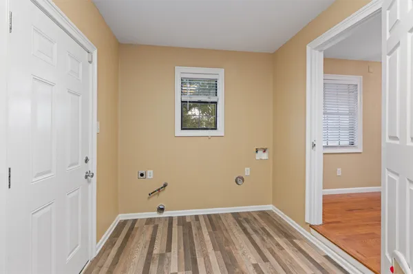 a view of an empty room with a ceiling fan
