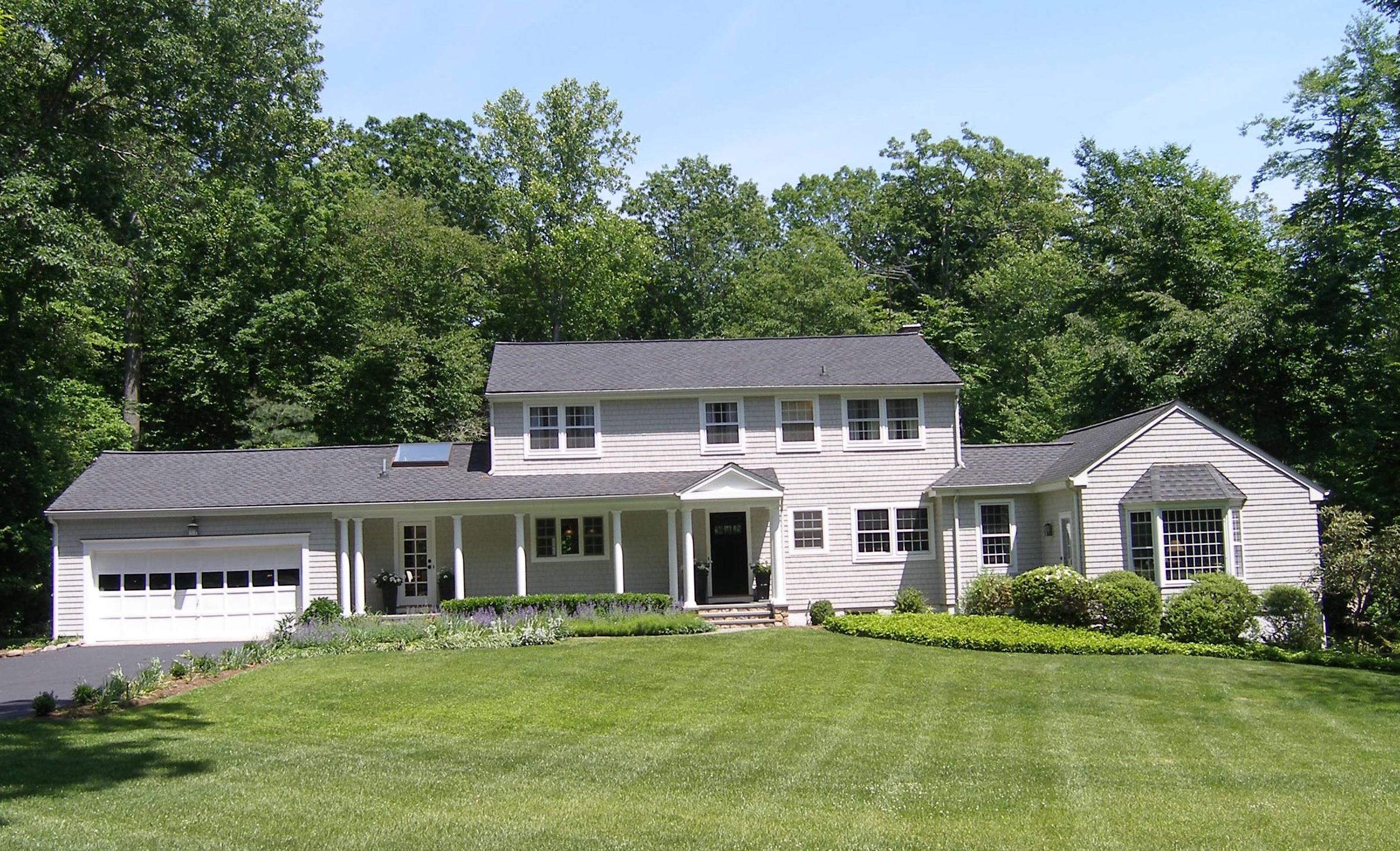719 Cheese Spring Road New Canaan, CT 06840 - Photo 1 of 24 a front view of a house with a yard