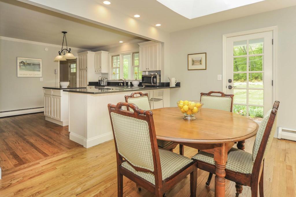 719 Cheese Spring Road New Canaan, CT 06840 - Photo 13 of 24 a view of a dining room with furniture and wooden floor