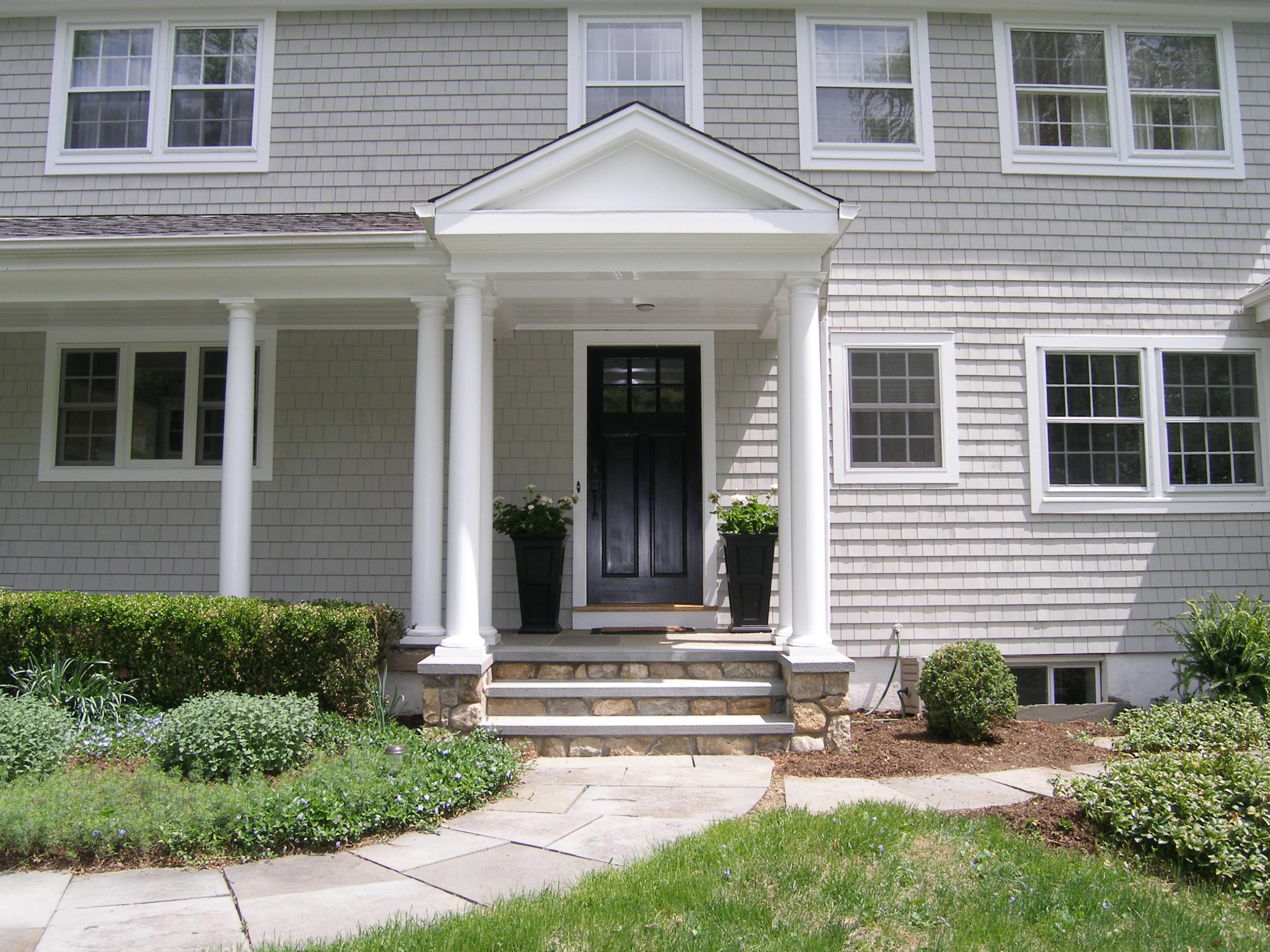 719 Cheese Spring Road New Canaan, CT 06840 - Photo 24 of 24 a view of a house with small yard plants and a large tree