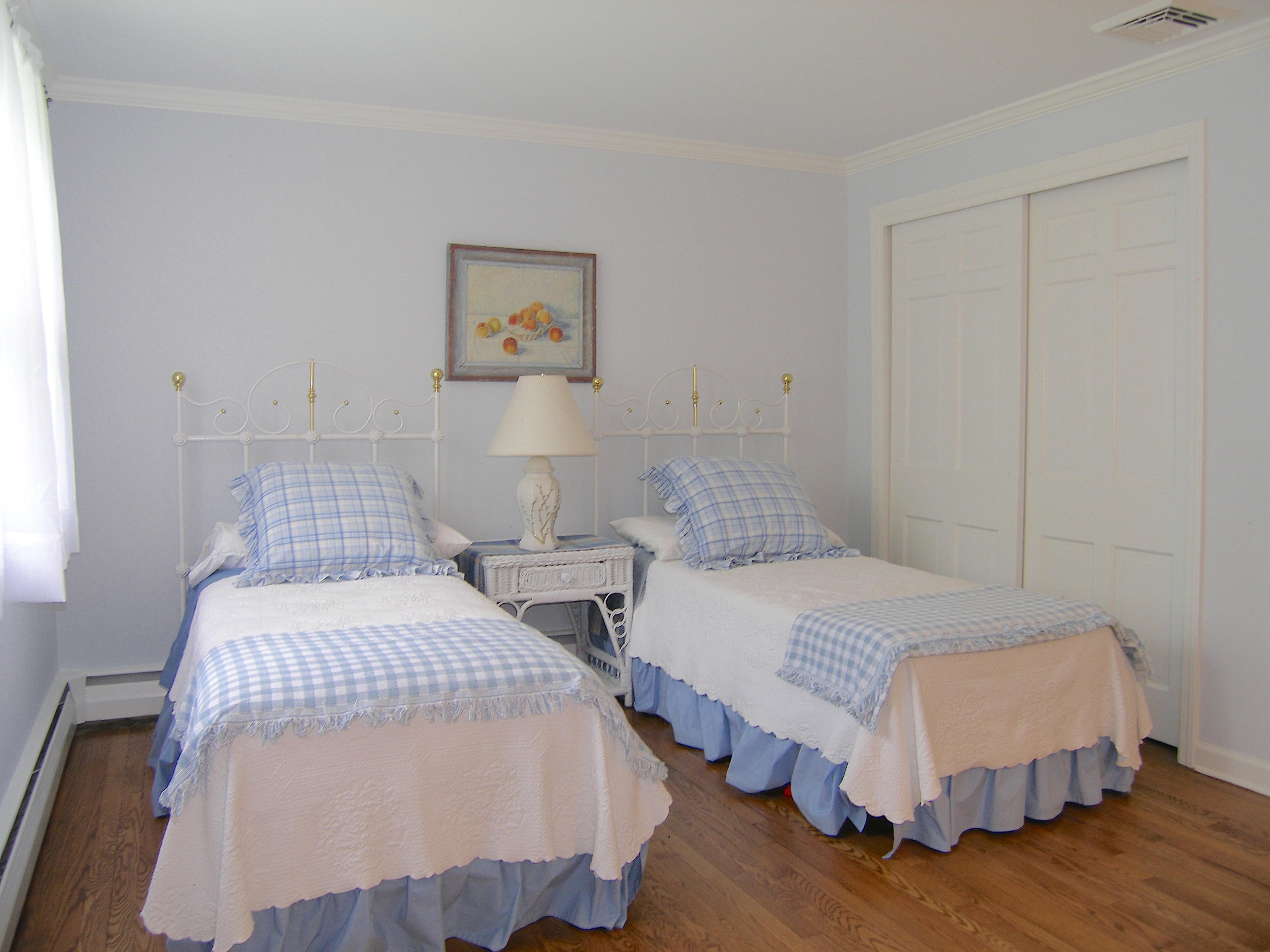 719 Cheese Spring Road New Canaan, CT 06840 - Photo 5 of 24 a bedroom with two beds and painting on the wall