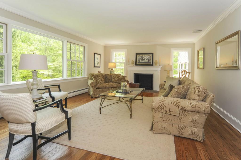 719 Cheese Spring Road New Canaan, CT 06840 - Photo 6 of 24 a living room with furniture and a fireplace