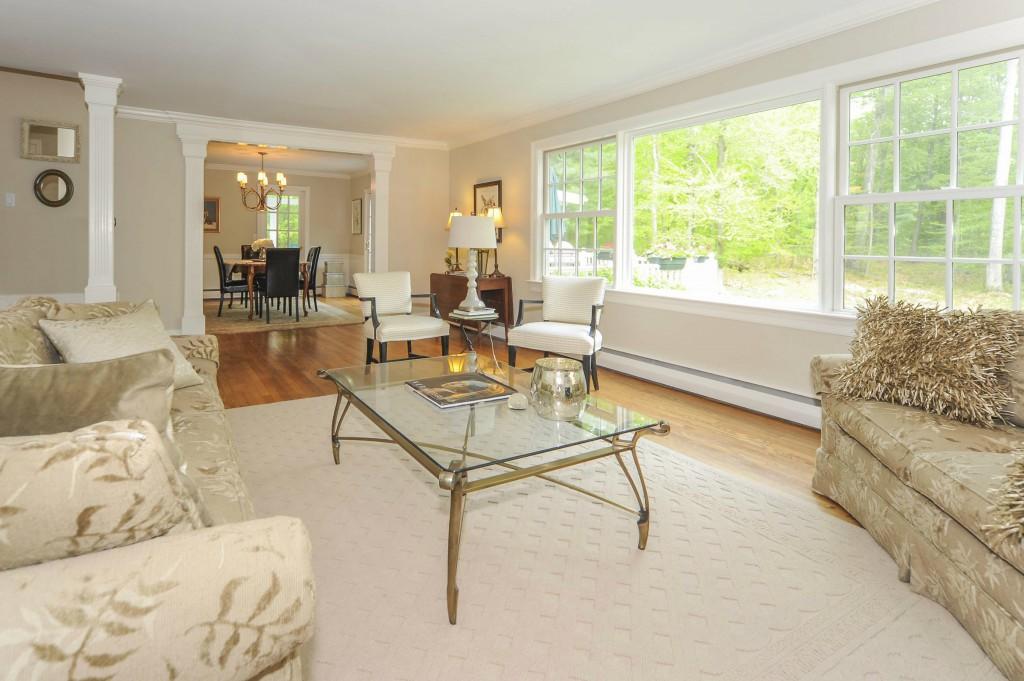 719 Cheese Spring Road New Canaan, CT 06840 - Photo 7 of 24 a living room with furniture and a large window