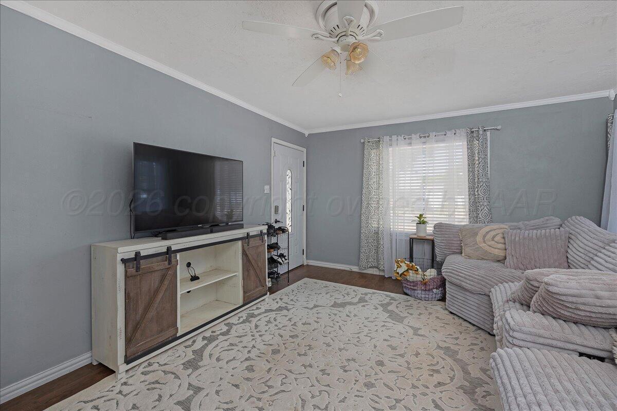 4011 Parker Street Amarillo, TX 79110 - Photo 4 of 17 a living room with furniture and a flat screen tv
