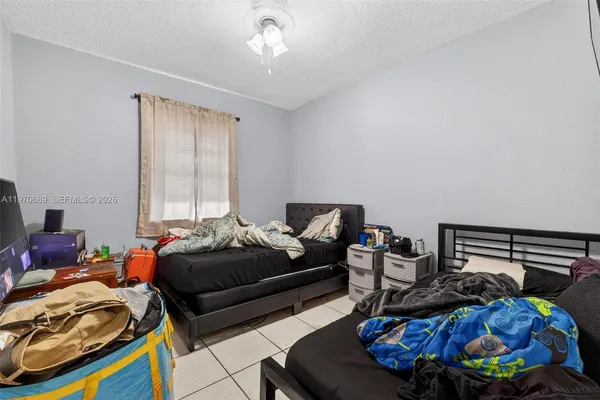 a bedroom with furniture and a window