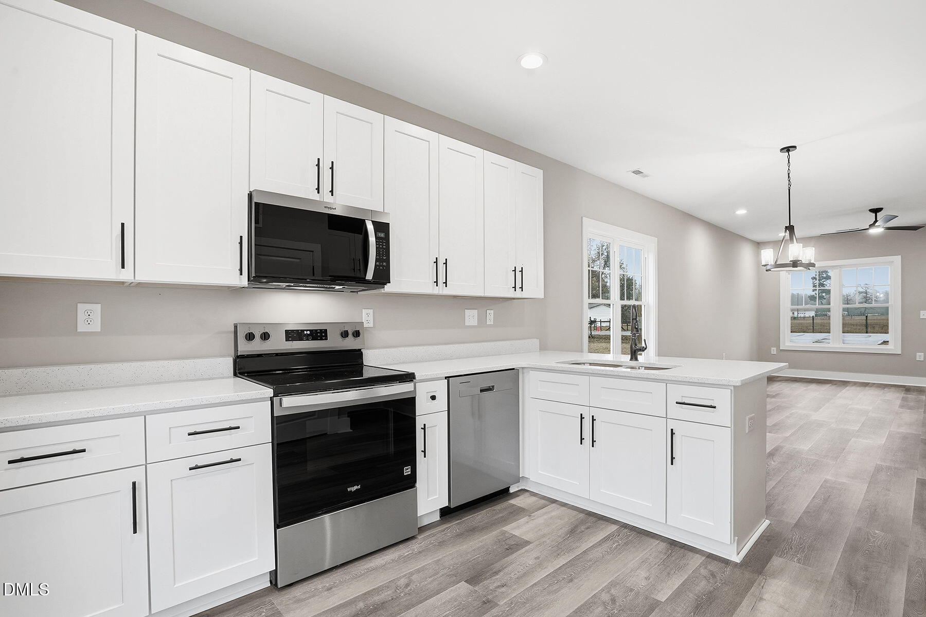 1029 Jada Allen Road Dunn, NC 28334 - Photo 12 of 31 a kitchen with appliances a sink and cabinets