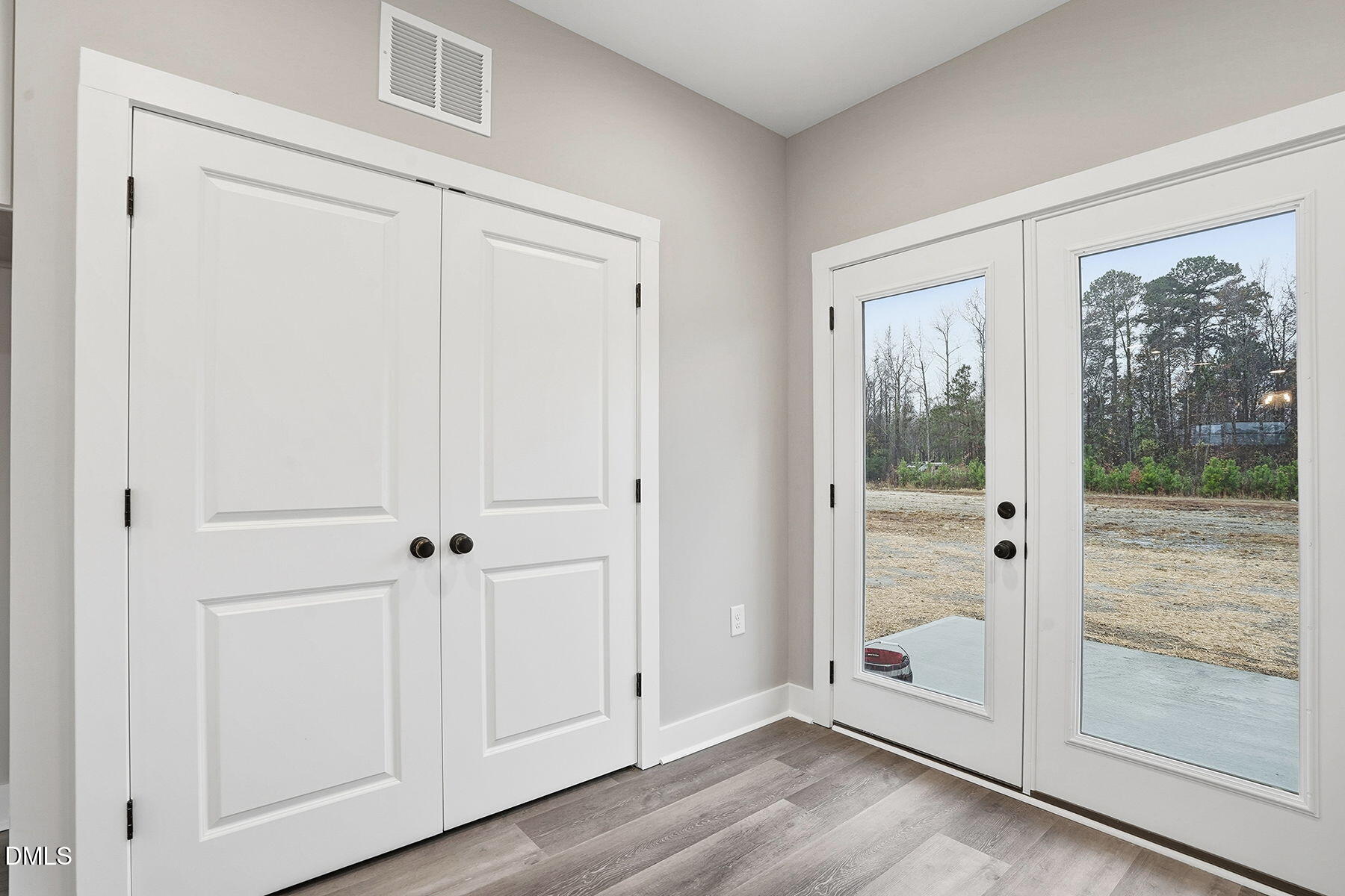 1029 Jada Allen Road Dunn, NC 28334 - Photo 15 of 31 a view of a small space with wooden floor a sliding door