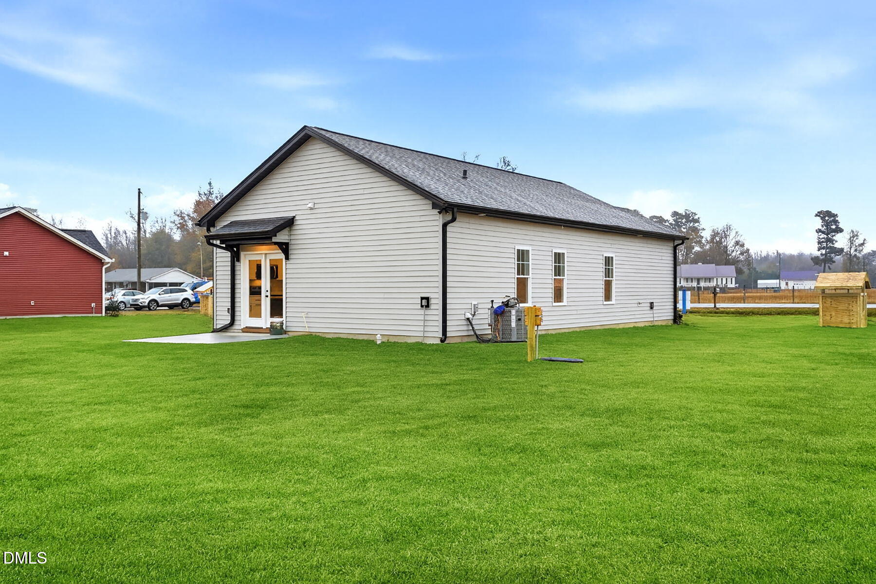 1029 Jada Allen Road Dunn, NC 28334 - Photo 26 of 31 a view of a house with a yard and garden