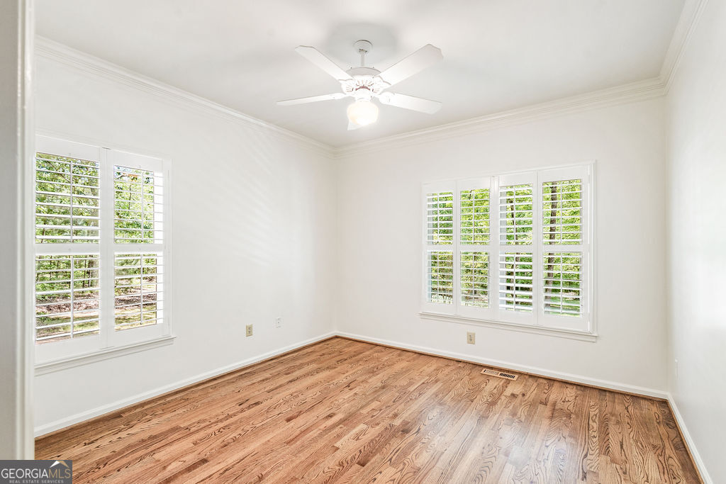 230 Haynes Road Moreland, GA 30259 - Photo 15 of 38 a view of an empty room with wooden floor and a window