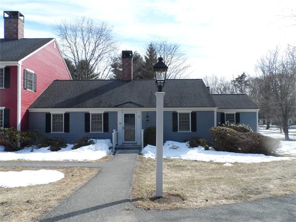48 Jericho Road, Unit 48 Weston, MA 02493 - Photo 1 of 19 a front view of a house with a yard covered in snow