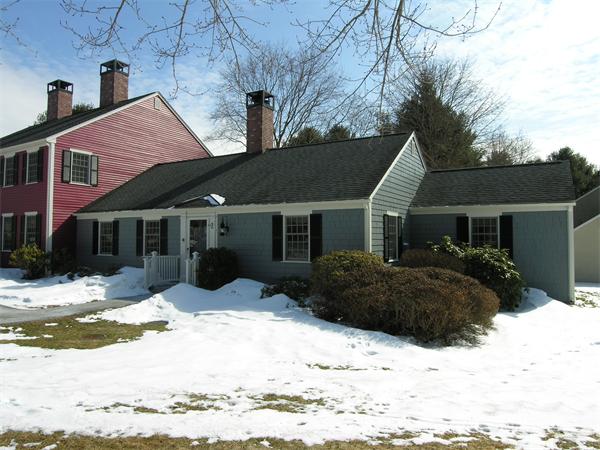 48 Jericho Road, Unit 48 Weston, MA 02493 - Photo 19 of 19 a front view of a house with a yard covered in snow