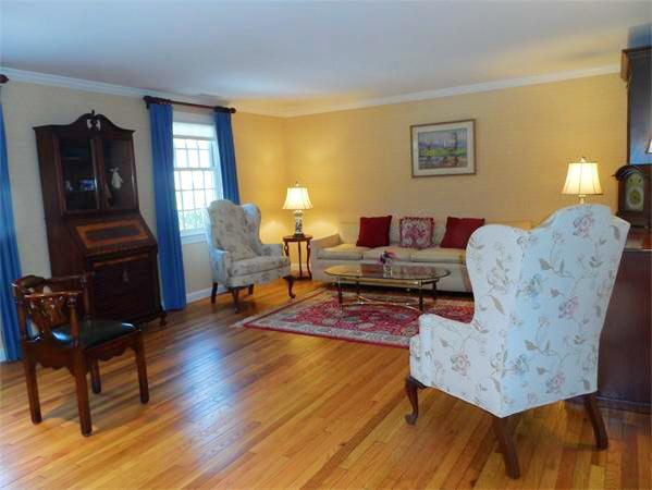 48 Jericho Road, Unit 48 Weston, MA 02493 - Photo 4 of 19 a living room with furniture and wooden floor