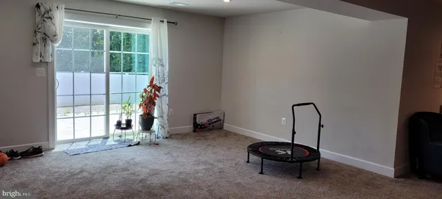 a room with a window and a bicycle