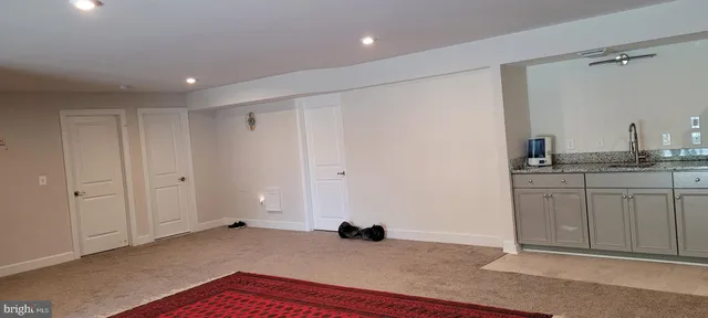 a view of a kitchen from the hallway