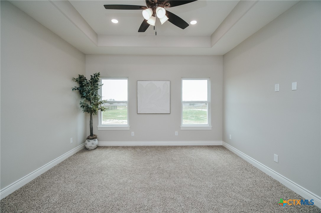 321 Whitetail Lane Victoria, TX 77905 - Photo 36 of 47 an empty room with windows and ceiling fan
