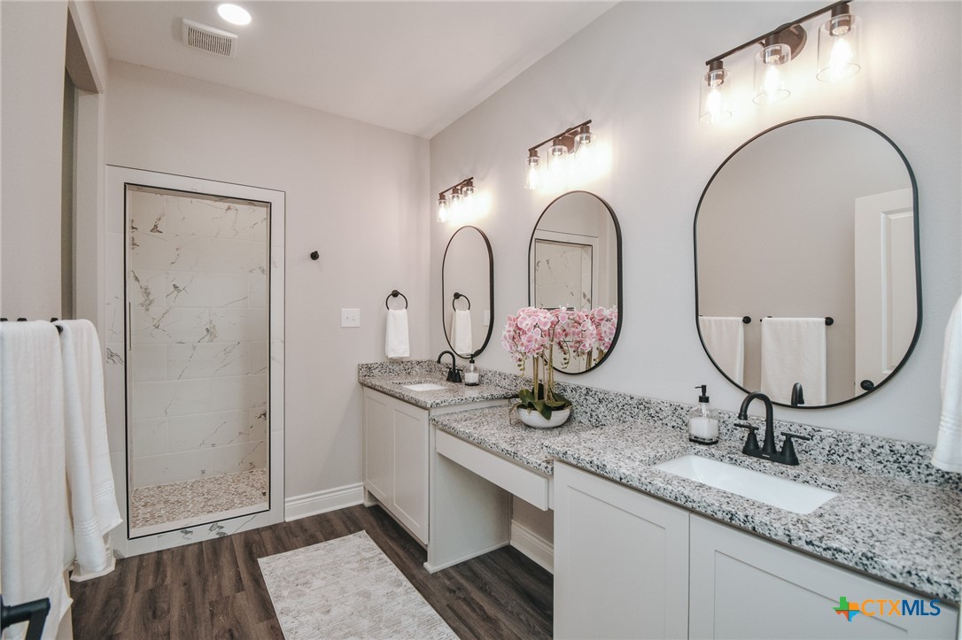 321 Whitetail Lane Victoria, TX 77905 - Photo 38 of 47 a bathroom with double vanity sinks and a two mirror