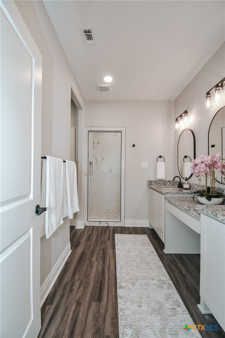 321 Whitetail Lane Victoria, TX 77905 - Photo 39 of 47 a bathroom with a sink and a mirror