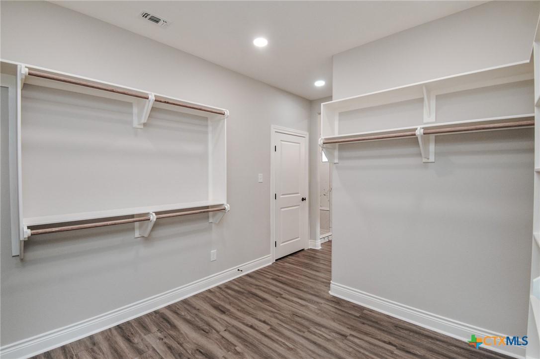321 Whitetail Lane Victoria, TX 77905 - Photo 43 of 47 a view of an empty room with wooden floor