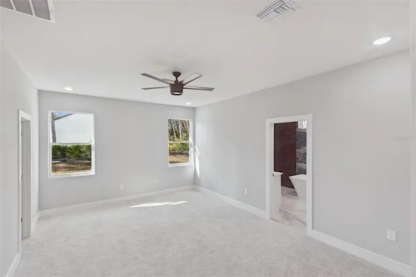 a view of livingroom with a ceiling fan and window