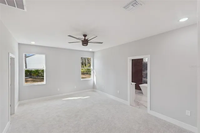 a view of livingroom with a ceiling fan and window