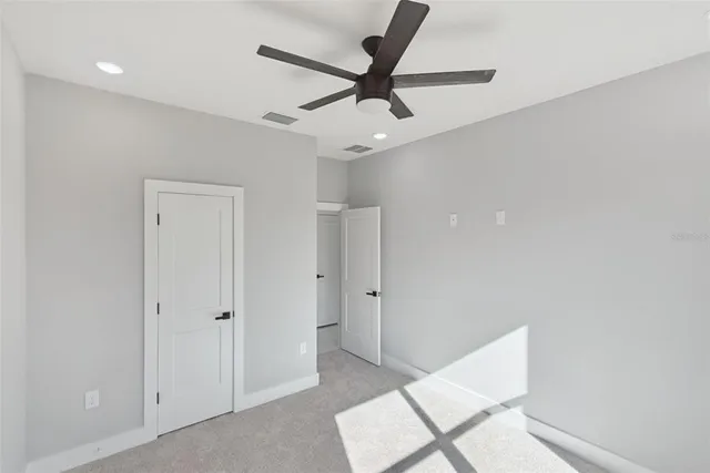 a view of a livingroom with a ceiling fan