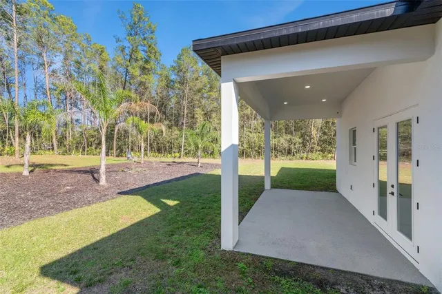 a view of a porch with a backyard
