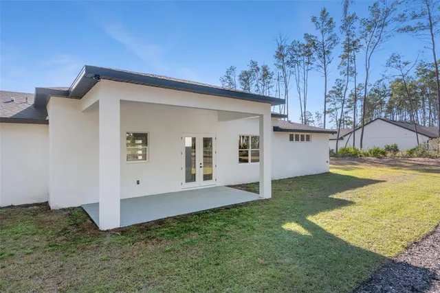 a view of backyard with a tub and stairs
