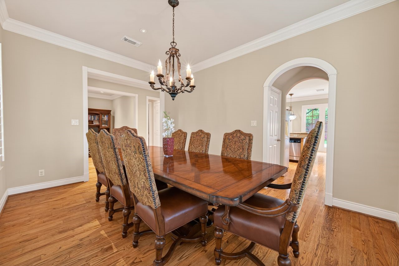 10932 Lasso Lane Houston, TX 77079 - Photo 5 of 38 a view of a dining room with furniture and wooden floor