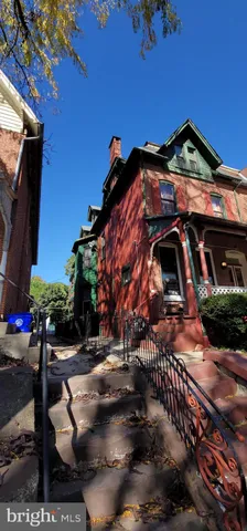a view of multiple houses with a yard