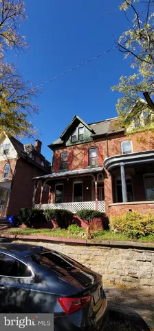 front view of a house with a small yard