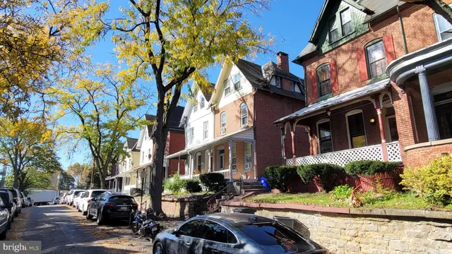 a front view of a building with street view