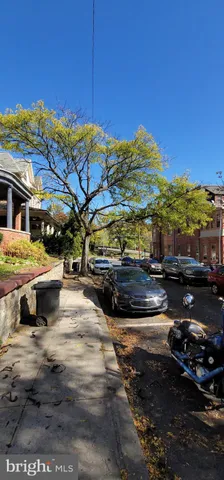 a view of a building with mountains in the background