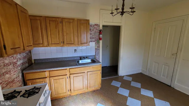 a kitchen with a sink and cabinets